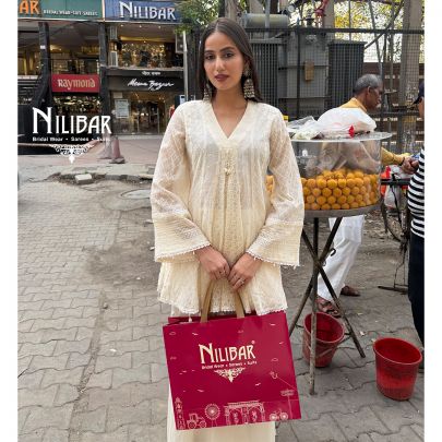 Ivory Peplum Chikankari Top Paired With Loose Palazzo